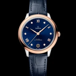 34 mm, acciaio‑oro Sedna™ su cinturino di pelle