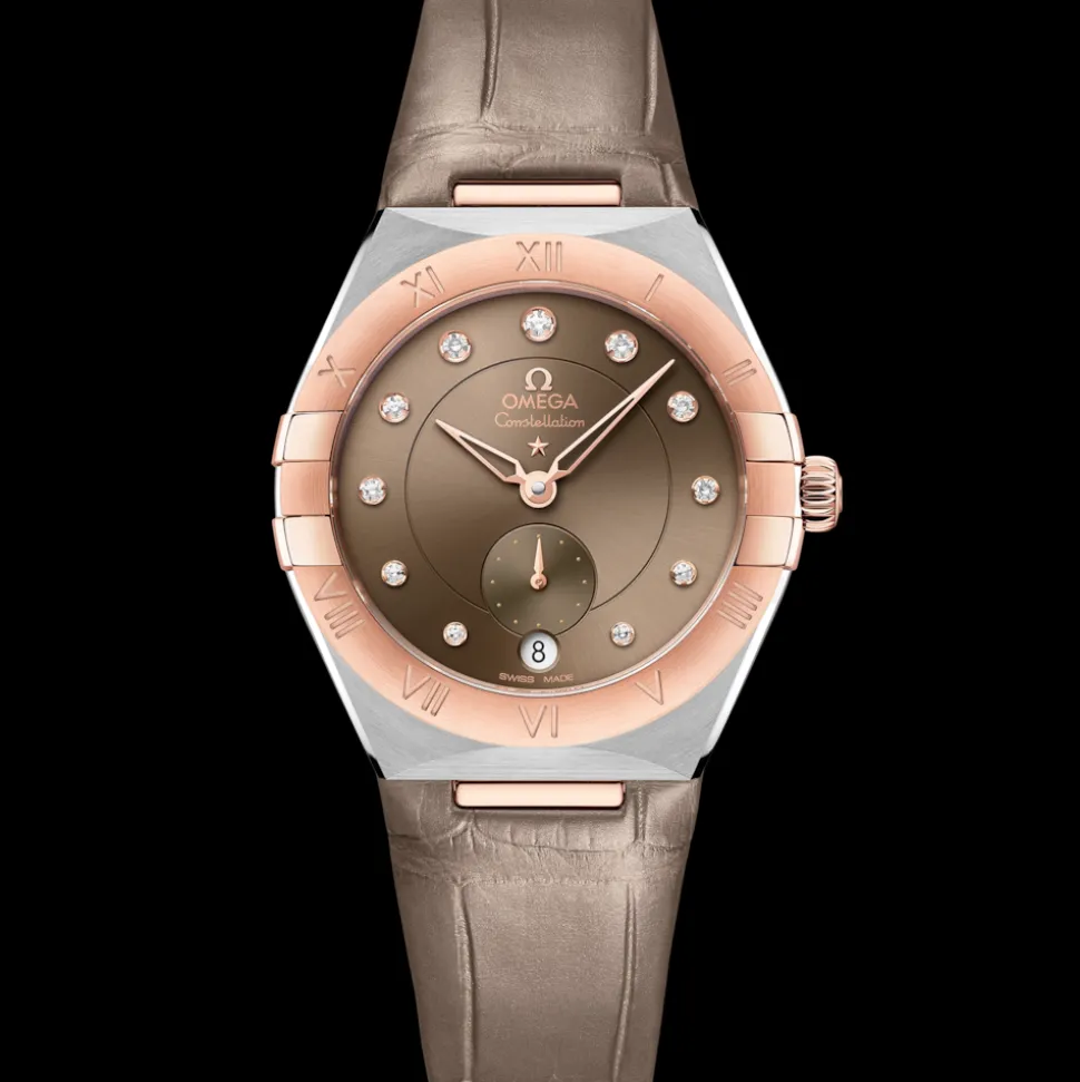 34 mm, acciaio‑oro Sedna™ su cinturino di pelle