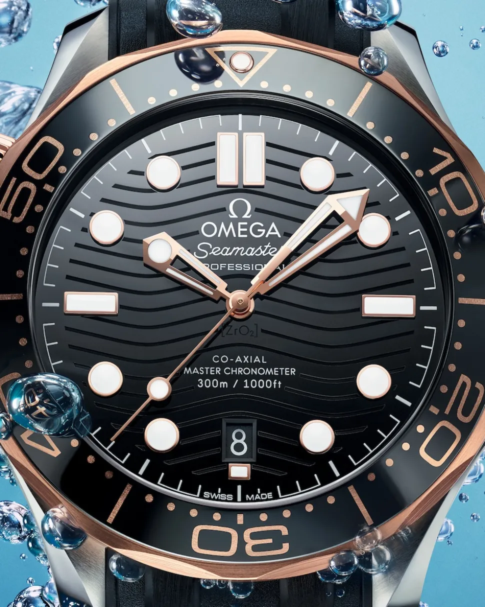 42 mm, acciaio‑oro Sedna™ su cinturino in caucciù