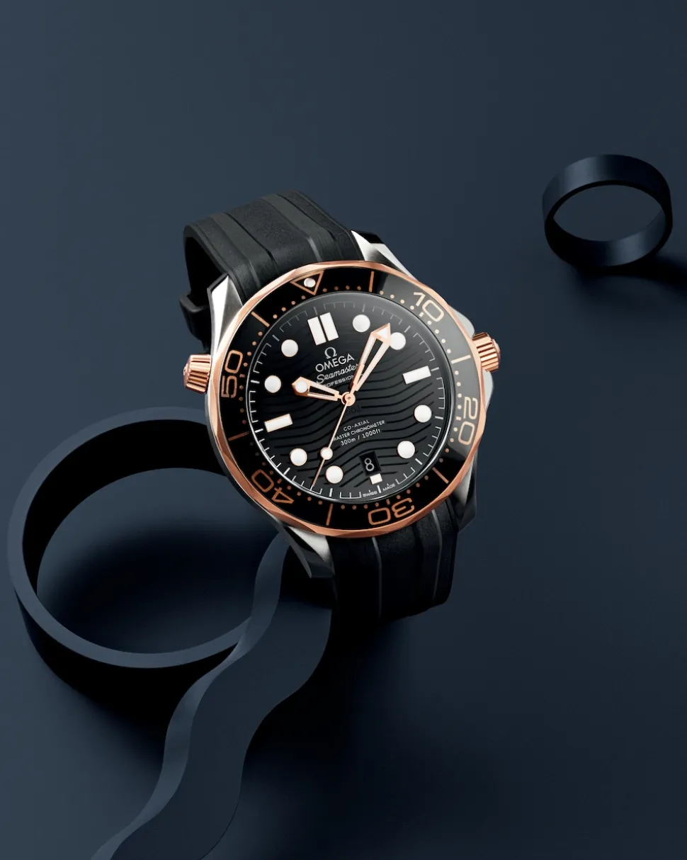 42 mm, acciaio‑oro Sedna™ su cinturino in caucciù
