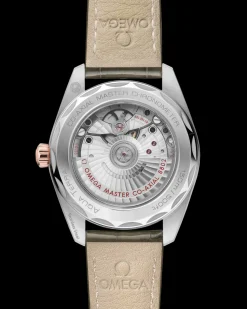 38 mm, acciaio‑oro Sedna™ su cinturino di pelle