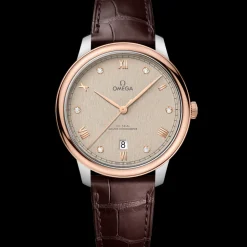 40 mm, acciaio‑oro Sedna™ su cinturino di pelle